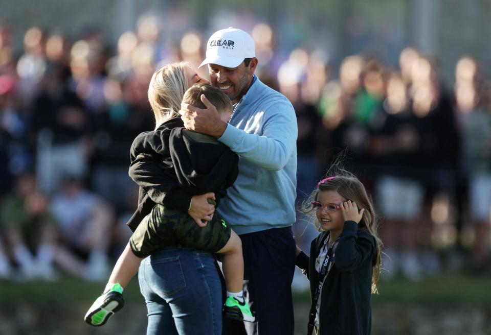 Charl Schwartzel celebrates with his family after winning the inaugural LIV golf invitational golf tournament at the Centurion Club.