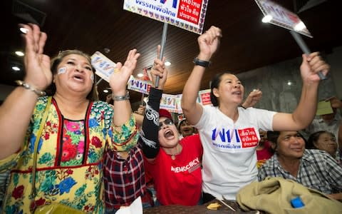 Pheu Thai supporters watch the election results come in - Credit: Wason Wanichakorn/AP