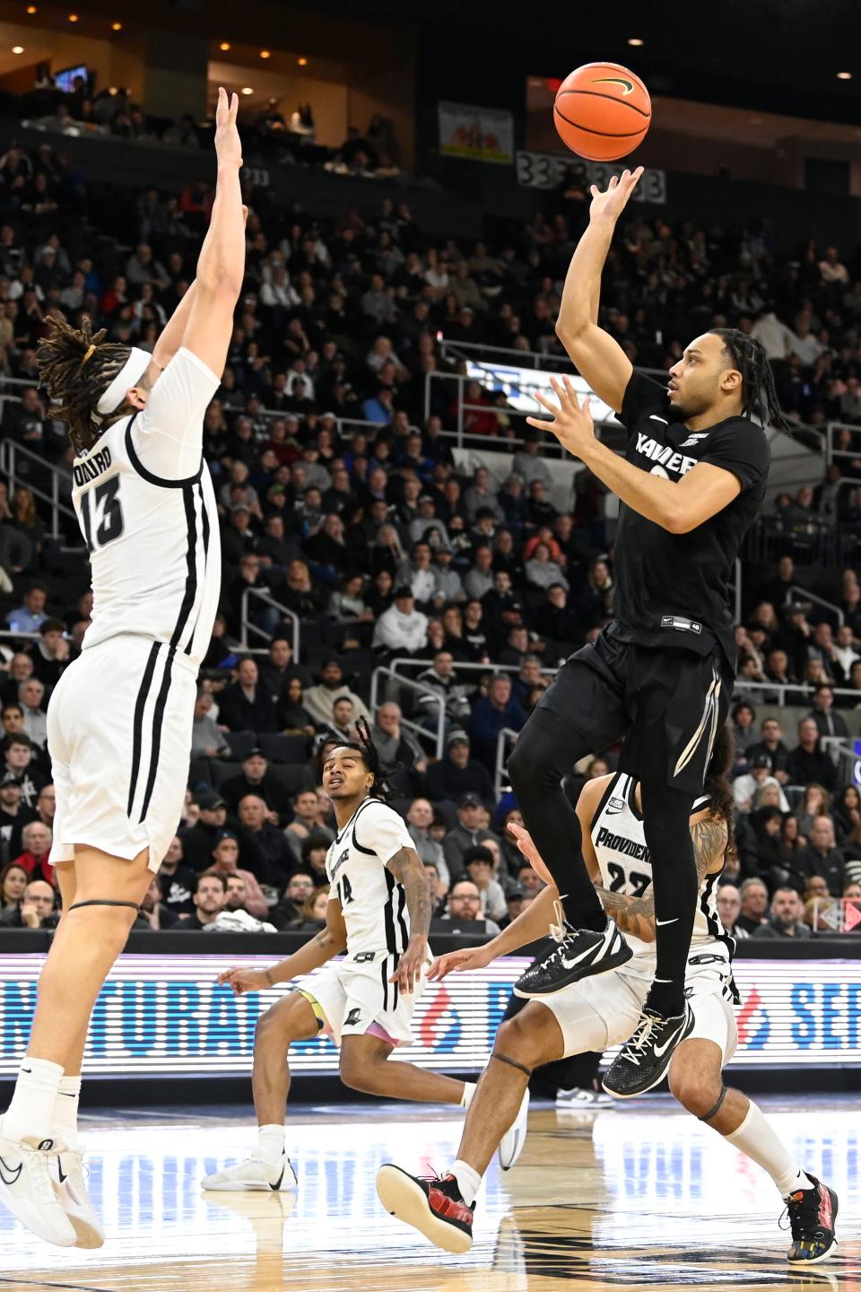 Trey Green puts up a one-handed shot in the second half of Xavier's 85-65 victory over Providence Saturday. Green led the Musketeers with 23 points.