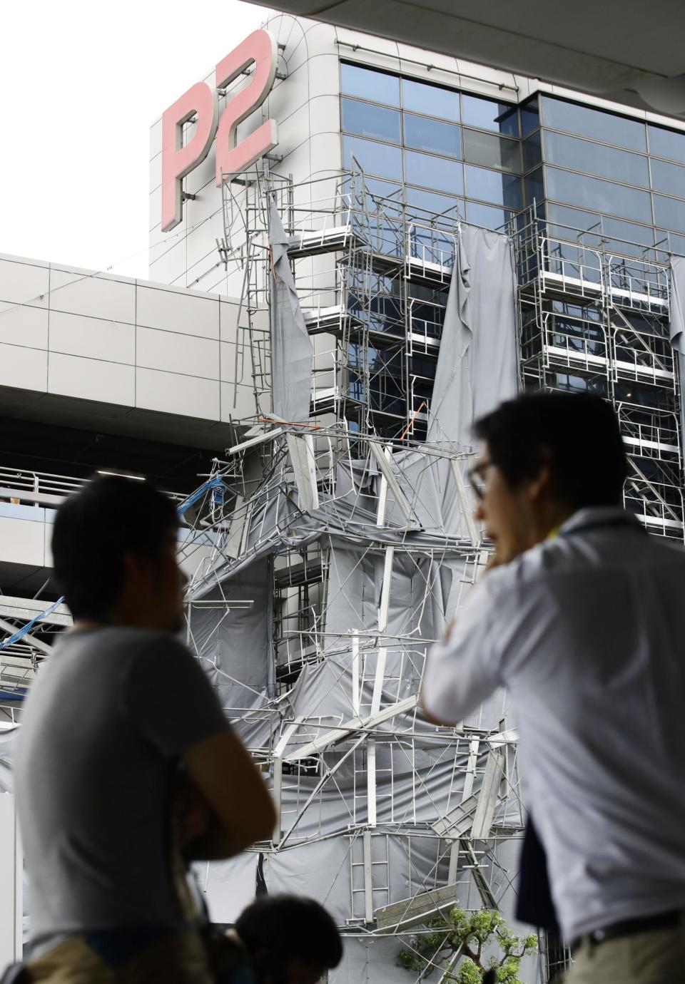 Scaffolding hit by typhoon is seen at a parking lot at Haneda airport in Tokyo, Monday, Sept. 9, 2019. (Kyodo News via AP)