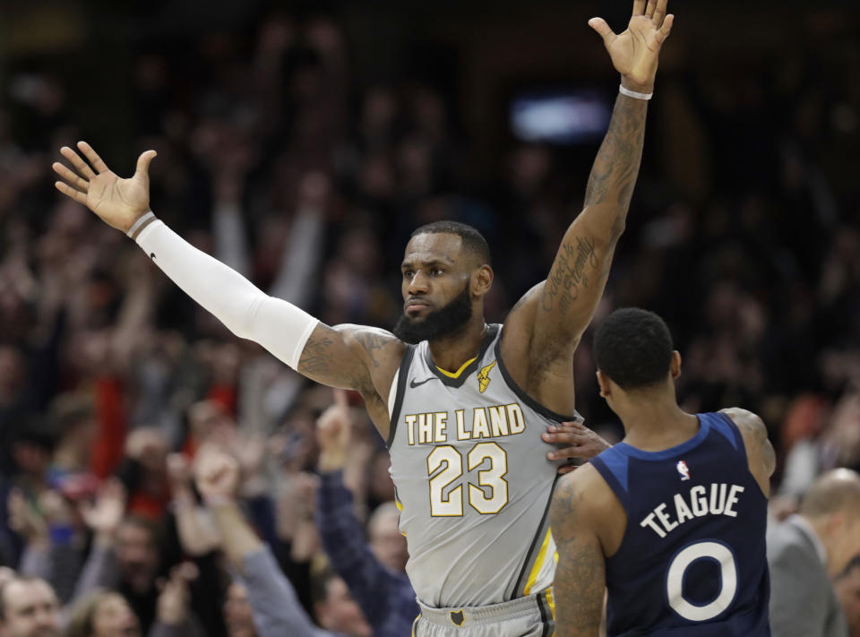 LeBron James, left, celebrates his game-winning basket in overtime Wednesday night. (AP)