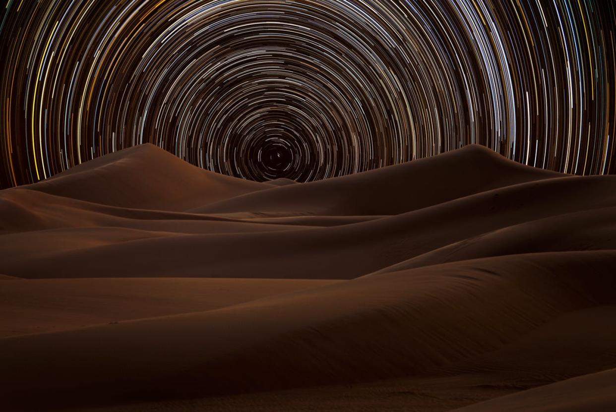 <span class="caption">Star trails in the desert.</span> <span class="attribution"><a class="link " href="https://www.gettyimages.com/detail/photo/star-trail-in-the-desert-riyadh-saudi-arabia-royalty-free-image/936327752?adppopup=true&uiloc=thumbnail_similar_images_adp" rel="nofollow noopener" target="_blank" data-ylk="slk:TARIQ_M_1 / Getty Images;elm:context_link;itc:0;sec:content-canvas">TARIQ_M_1 / Getty Images</a></span>