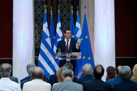 Greek Prime Minister Alexis Tsipras, wearing a tie, speaks at the parliamentary group of Syriza and Independent Greeks in Athens, Greece June 22, 2018. REUTERS/Costas Baltas