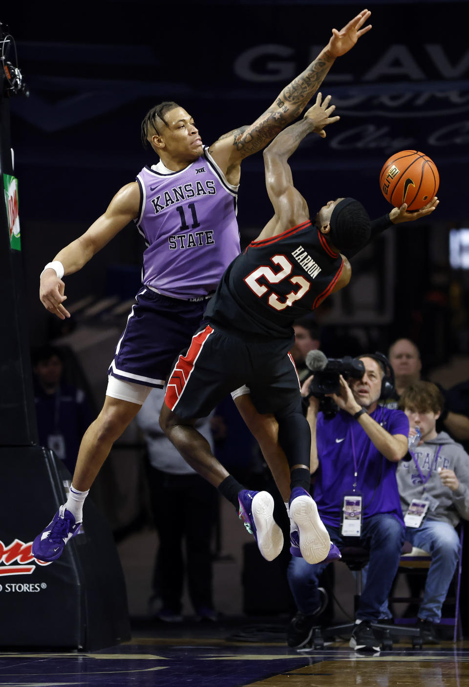 Kansas State forward Keyontae Johnson (11) attempts to block a shot from Texas Tech guard De'Vion Harmon (23) during the second half of an NCAA college basketball game, Saturday, Jan. 21, 2023, in Manhattan, Kan. (AP Photo/Colin E. Braley)