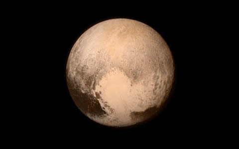 The first close up image of Pluto, taken by New Horizons - Credit: Nasa