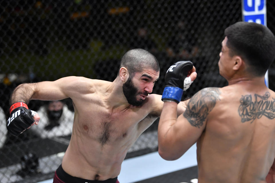 LAS VEGAS, NEVADA - FEBRUARY 20: In this UFC handout, (L-R) Aiemann Zahabi of Canada punches Drako Rodriguez in a bantamweight bout during the UFC Fight Night event at UFC APEX on February 20, 2021 in Las Vegas, Nevada. (Photo by Chris Unger/Zuffa LLC)