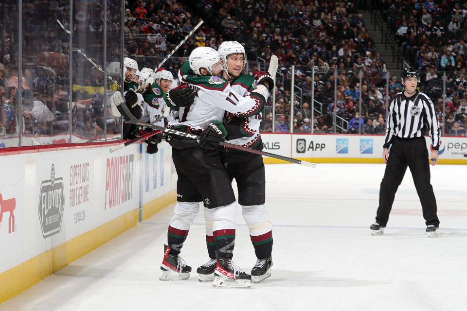 DENVER, COLORADO - FEBRUARY 01: Alex Galchenyuk #17 of the Arizona Coyotes celebrates with teammate Ilya Lyubushkin #46 after scoring a goal against the Colorado Avalanche at Ball Arena on February 01, 2022 in Denver, Colorado. (Photo by Michael Martin/NHLI via Getty Images)