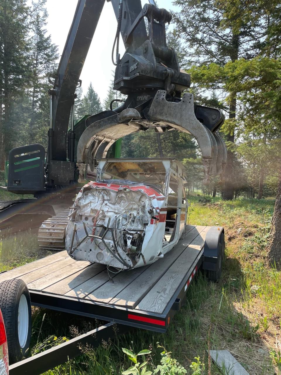 The salvaged plane fuselage that CASARA uses as a fake crash site for search and rescue training was carried up a mountain on a trailer bed in 2021.