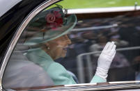 Britain's Queen Elizabeth II arrives by car during day five of of the Royal Ascot horserace meeting, at Ascot Racecourse, in Ascot, England, Saturday June 19, 2021. (Andrew Matthews/PA via AP)