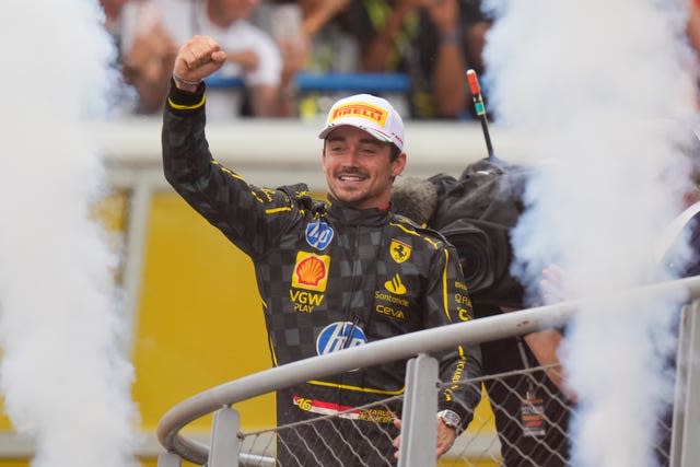 Ferrari driver Charles Leclerc celebrates on the podium after victory in the Italian Grand Prix at Monza 