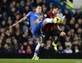 Chelsea's John Terry (L) challenges West Bromwich Albion's Shane Long during their English Premier League soccer match at Stamford Bridge in London November 9, 2013.