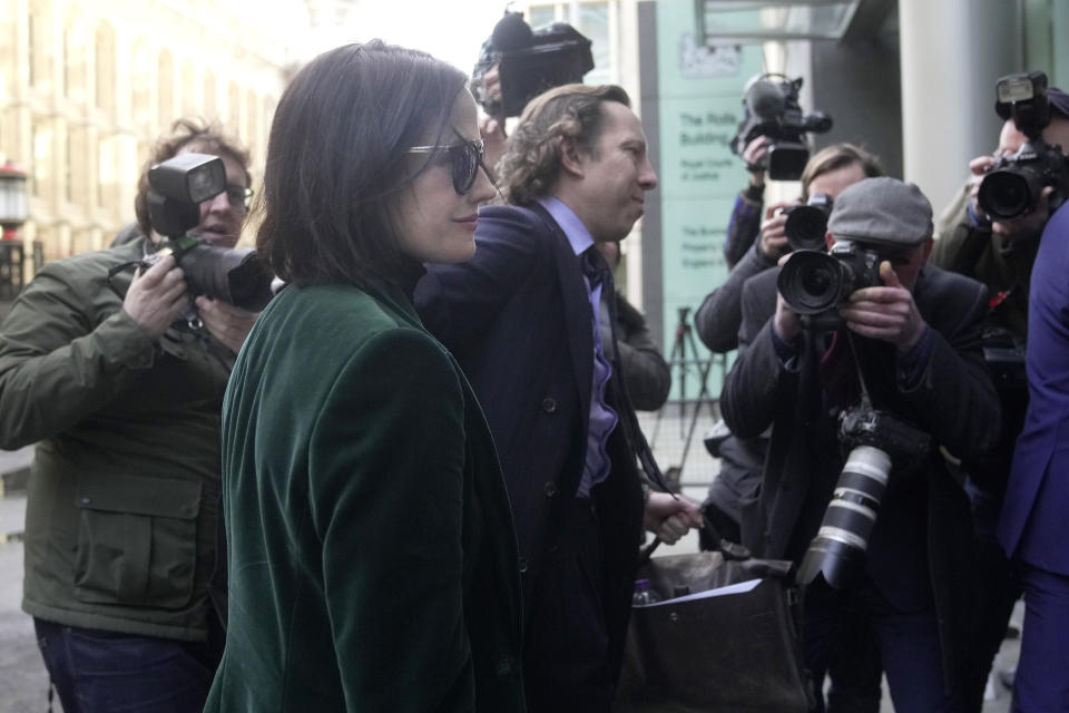 Actress Eva Green arrives at the High Court in London, Monday, Jan. 30, 2023. A lawyer for Eva Green on Thursday, Jan. 26, 2023 accused producers of a collapsed film of trying to damage the performer's reputation by depicting her as a "diva." The French actress, who played Vesper Lynd in James Bond thriller "Casino Royale," is suing producers for a $1 million fee she says she is owed for "A Patriot." (AP Photo/Kin Cheung)