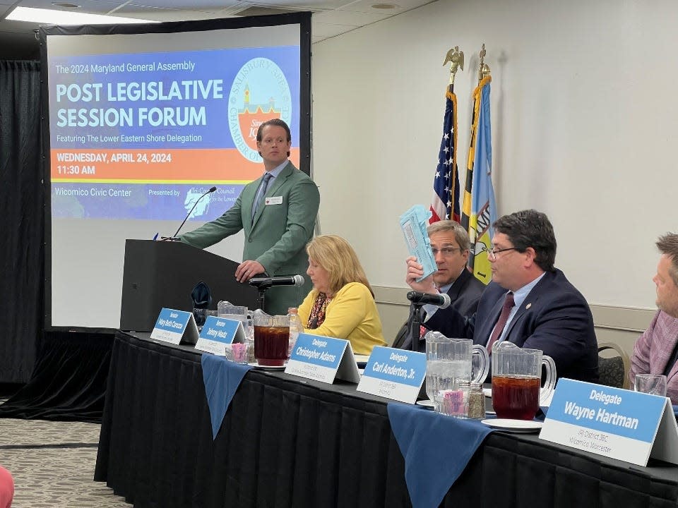 Del. Chris Adams, R-Wicomico, holds up documents for his properties from the Department of Assessments and Taxation that showed increased fees during a forum in Salisbury on April 24, 2024. "There will be more business owners who get out of the business of providing housing," he said in an interview.