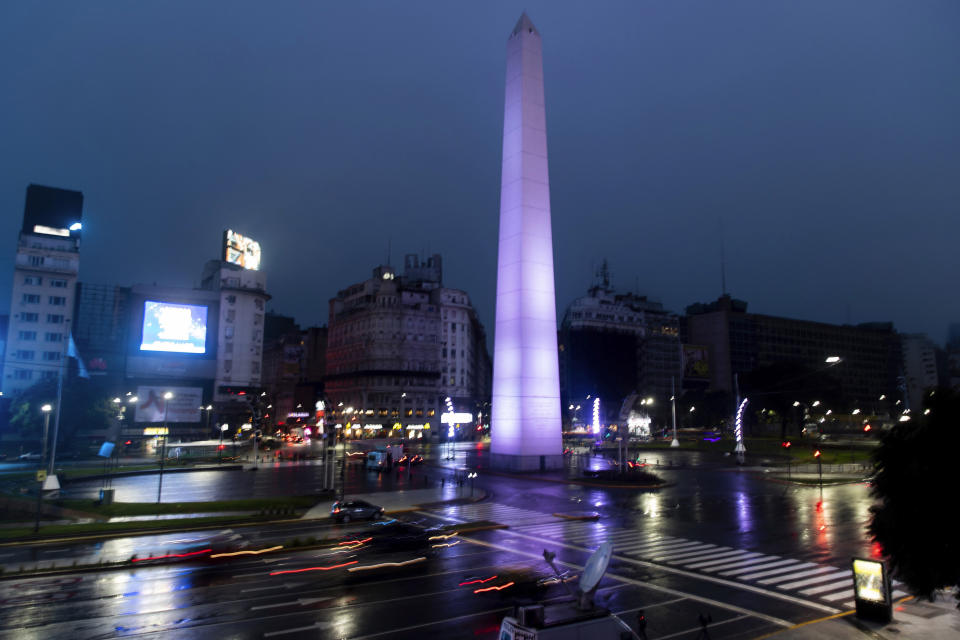 Cars drive on the 9 de Julio Ave, past the illuminated Obelisk monument in Buenos Aires, Argentina, early Monday morning, June 17, 2019. As lights turned back on across Argentina, Uruguay and Paraguay after a massive blackout that hit tens of millions people, authorities were still largely in the dark about what caused the collapse of the interconnected grid and were tallying the damage from the unforeseen disaster. (AP Photo/Tomas F. Cuesta)