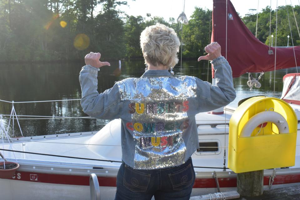 Local singer Beth Sharpley shows off her bedazzled jacket prior to her performance at Dockside’s inaugural “Dock Jam” on Saturday, May 20, 2023, in Pocomoke City, Maryland.