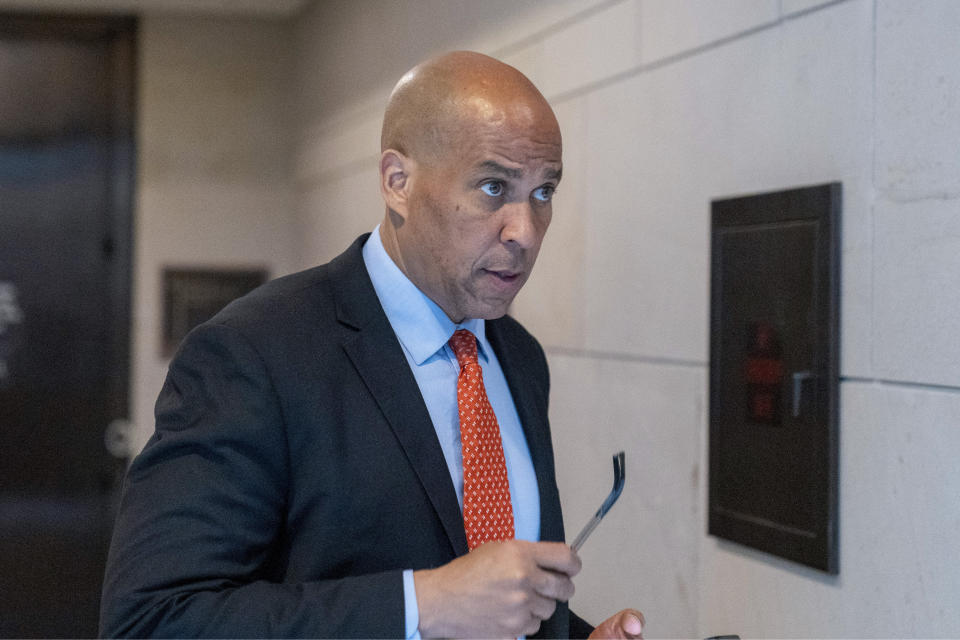 FILE - Sen. Cory Booker, D-N.J., departs after a closed door briefing on Capitol Hill, , April 19, 2023, in Washington. B ooker is calling on Sen. Bob Menendez to resign, saying in a statement that the federal bribery charges unveiled on Friday against his fellow New Jersey Democrat contain ”shocking allegations of corruption and specific, disturbing details of wrongdoing.” (AP Photo/Alex Brandon, File)