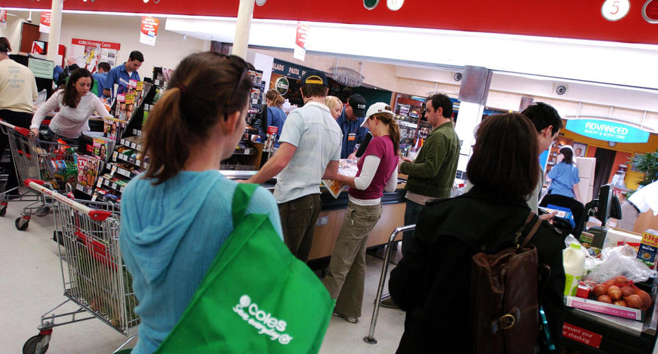 Shoppers lining up at Coles Supermarkets.