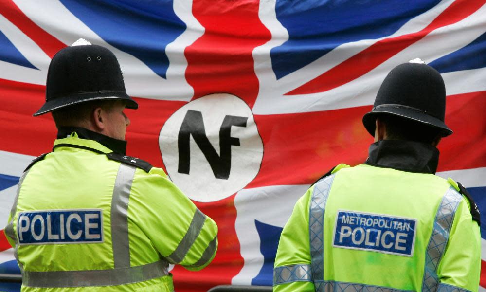 Police watch a demonstration by the far-right National Front in London