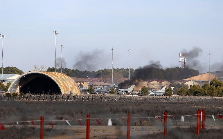 Smoke rises from Los Llanos military base in Albacete, southern Spain after a plane crash on January 26, 2015