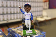 A Hank Aaron bobblehead commemorating the 50th anniversary of Aaron breaking Babe Ruth's career home run record is shown before a baseball game between New York Mets and Atlanta Braves Monday, April 8, 2024, in Atlanta. Aaron hit his 715th home run on April 8, 1974. (AP Photo/John Bazemore)