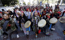<p>Women drummers sing as they lead a march during an Indigenous Peoples Day event Monday, Oct. 9, 2017, in Seattle, Wash. (Photo: Elaine Thompson/AP) </p>
