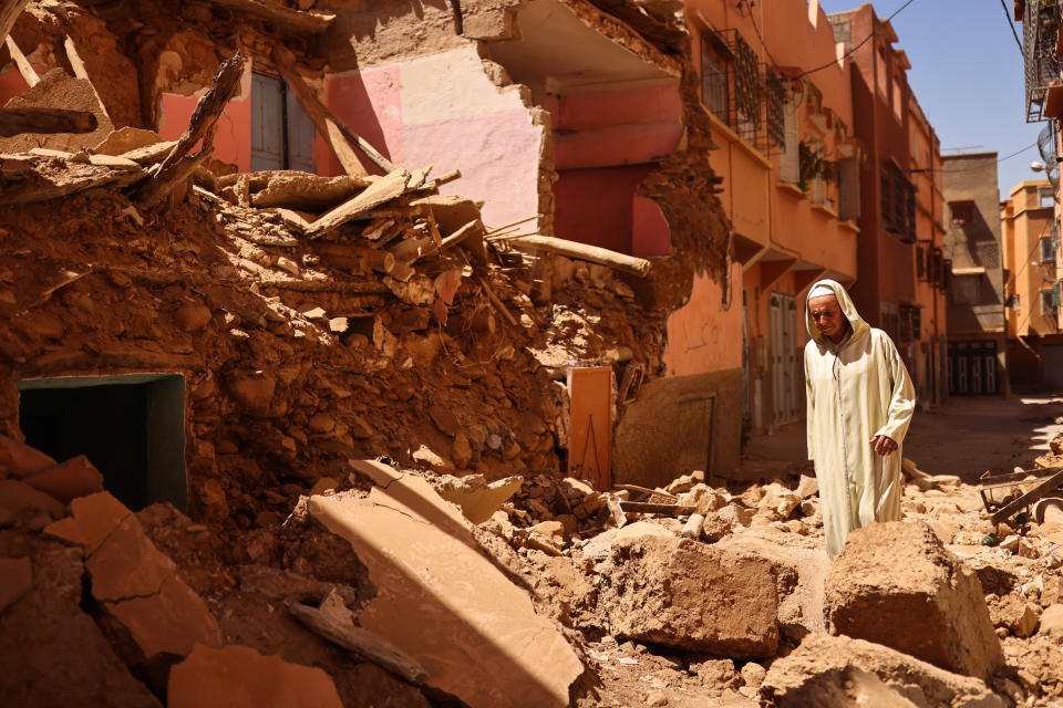 Mohamed Sebbagh, 66, stands in front of his destroyed house, in the aftermath of a deadly earthquake, in Amizmiz, Morocco, September 10, 2023. REUTERS/Nacho Doce