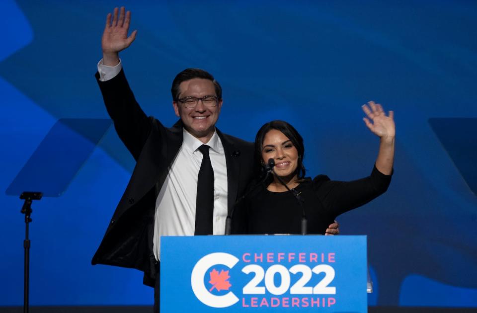 Newly elected Conservative leader Pierre Poilievre and his wife Anaida wave as they take the stage after winning the leadership, Saturday, September 10, 2022 in Ottawa.