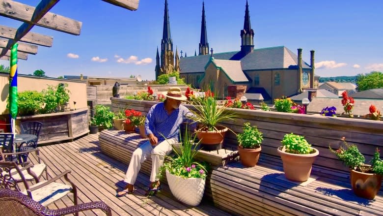 'It's my yoga, it relaxes me': Rooftop veggie garden provides salads and serenity