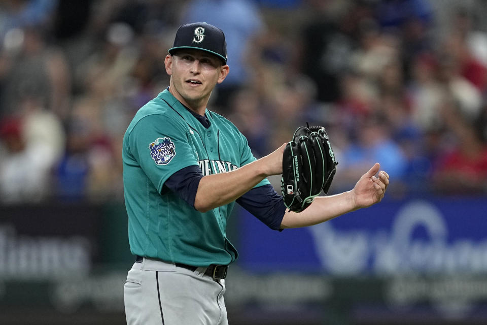 Seattle Mariners starting pitcher Chris Flexen stands behind the mound after giving up a two-run home run to Texas Rangers' Nathaniel Lowe during the seventh inning of a baseball game Saturday, June 3, 2023, in Arlington, Texas. (AP Photo/Tony Gutierrez)