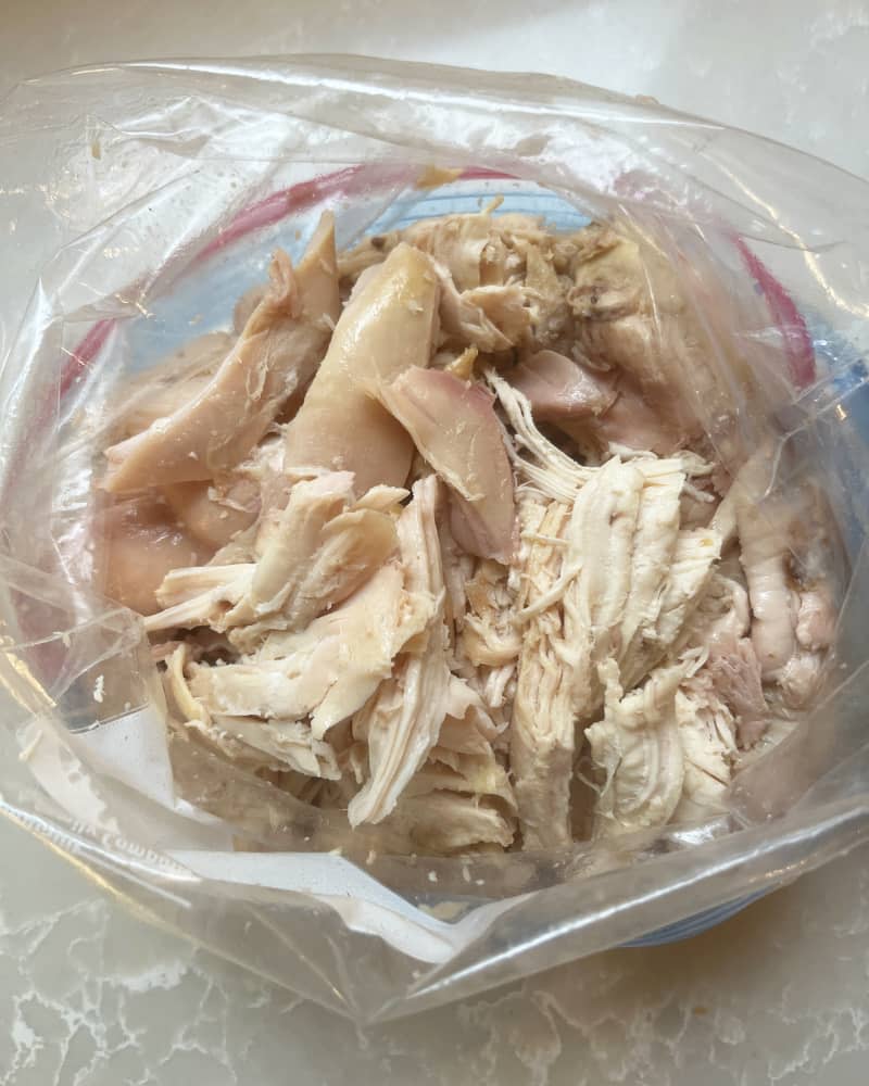 shredded chicken meat in a plastic bag