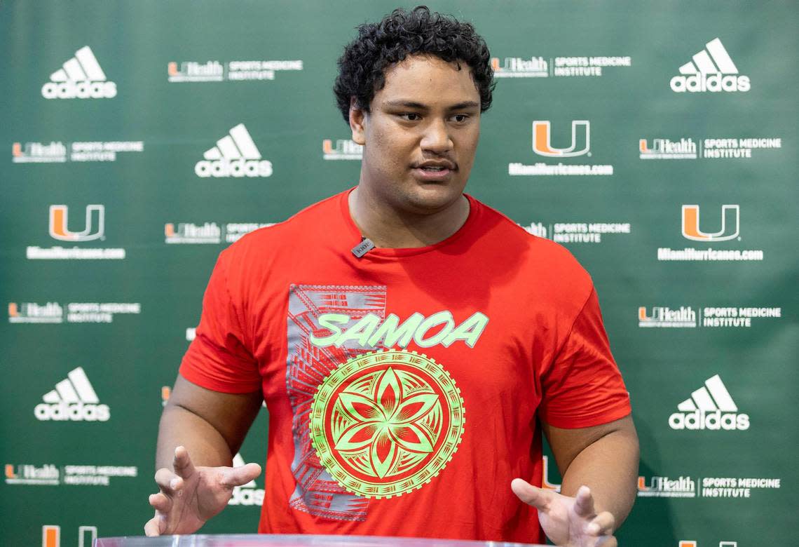 Miami Hurricanes offensive line Francis Mauigoa talks to reporters after participating in a spring football practice session at the University of Miami’s Greentree Field on Tuesday, April 11, 2023, in Coral Gables, Fla.