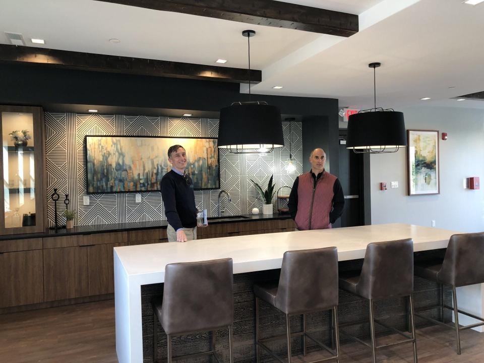 Jason Duckworth (left), president of Arcadia Land Co., and Ben Altman, president of Altman Management Co., stand in the community club room at The Martin At Doylestown, where apartments are now for lease..