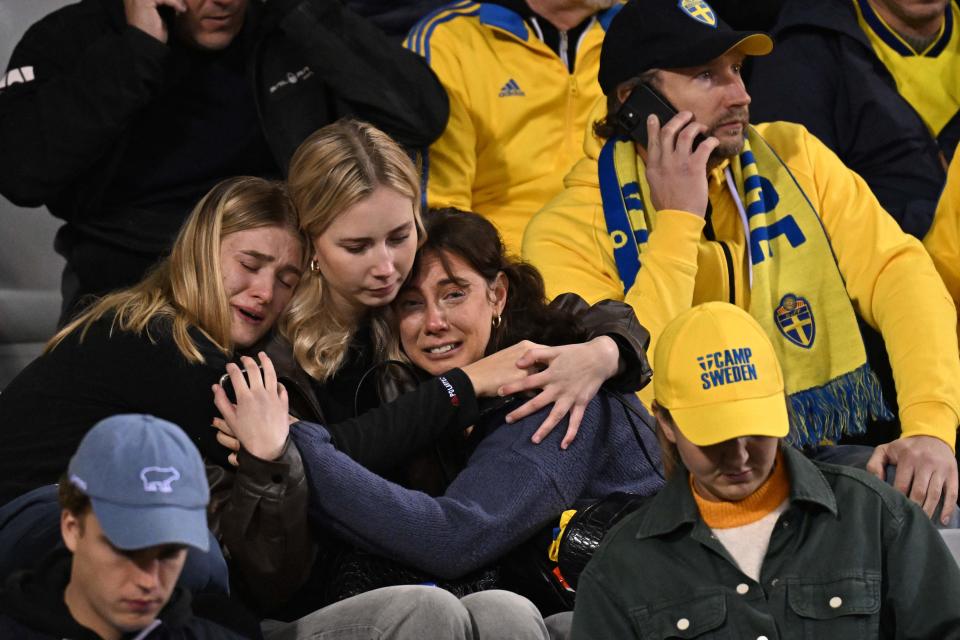 Swedish supporters react as they wait in the stand (AFP via Getty Images)