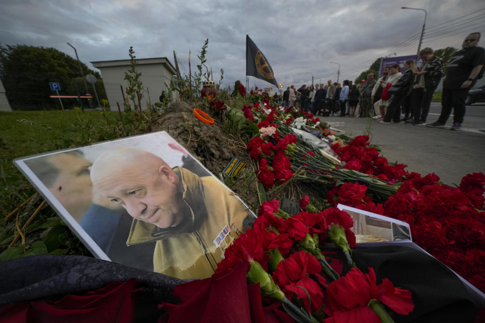 A portrait of the owner of private military company Wagner Group Yevgeny Prigozhin lays at an informal memorial next to the former PMC Wagner Centre in St. Petersburg, Russia, Thursday, Aug. 24, 2023. / Credit: Dmitri Lovetsky / AP