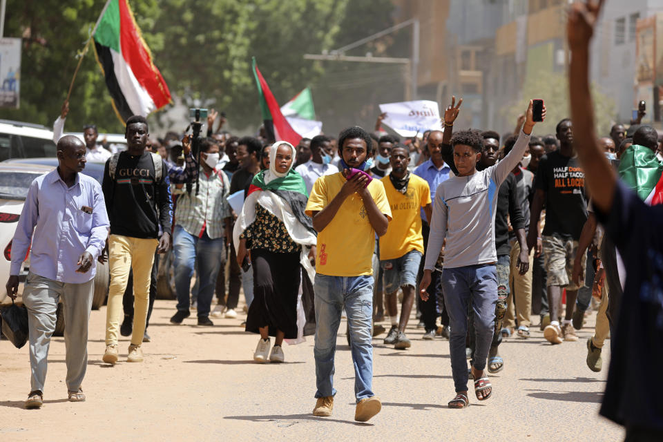 Sudanese protesters march to the Cabinet’s headquarters in the capital, Khartoum, Sudan, Monday, Aug. 17, 2020. The protesters returned to the streets Monday to pressure transitional authorities for more reforms, a year after a power-sharing deal between the pro-democracy movement and the generals. (AP Photo/Marwan Ali)