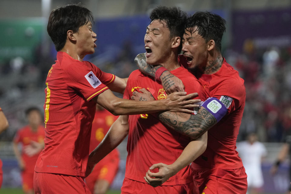 China's Zhu Chenjie, center, celebrates after scoring a goal which was overturned by VAR during the Asian Cup Group A soccer match between China and Tajikistan at Abdullah Bin Khalifa Stadium in Doha, Qatar, Saturday, Jan. 13, 2024. (AP Photo/Thanassis Stavrakis)