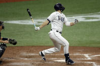 Tampa Bay Rays' Austin Meadows follows through on a two-run single off New York Yankees relief pitcher Luis Avilan during the fourth inning of the second game of a doubleheader baseball game Saturday, Aug. 8, 2020, in St. Petersburg, Fla. RaysTampa Bay Rays' Willy Adames and Kevin Kiermaier scored. (AP Photo/Chris O'Meara)