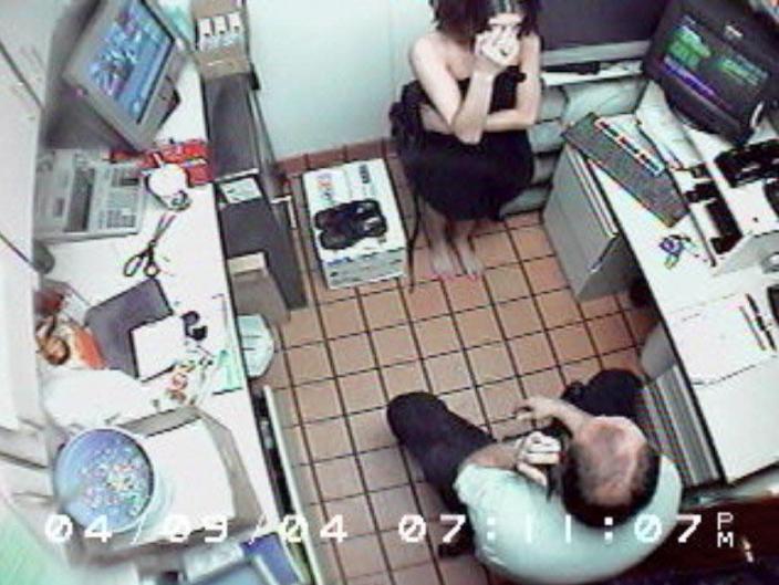 A Mount Washington McDonald's surveillance video entered into evidence shows a tearful Louise Ogborn covering her face as Walter Nix Jr. takes more orders from a caller identifying himself as &quot;Officer Scott.&quot;