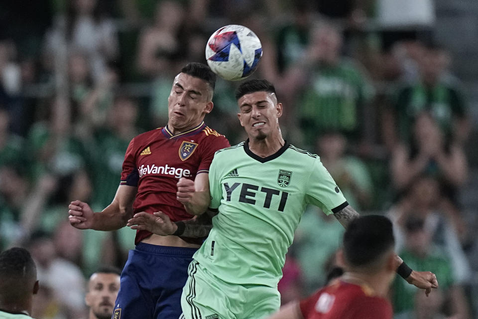 Real Salt Lake midfielder Braian Ojeda, left, and Austin FC midfielder Emiliano Rigoni leap for the ball during the second half of an MLS soccer match in Austin, Texas, Saturday, June 3, 2023. (AP Photo/Eric Gay)