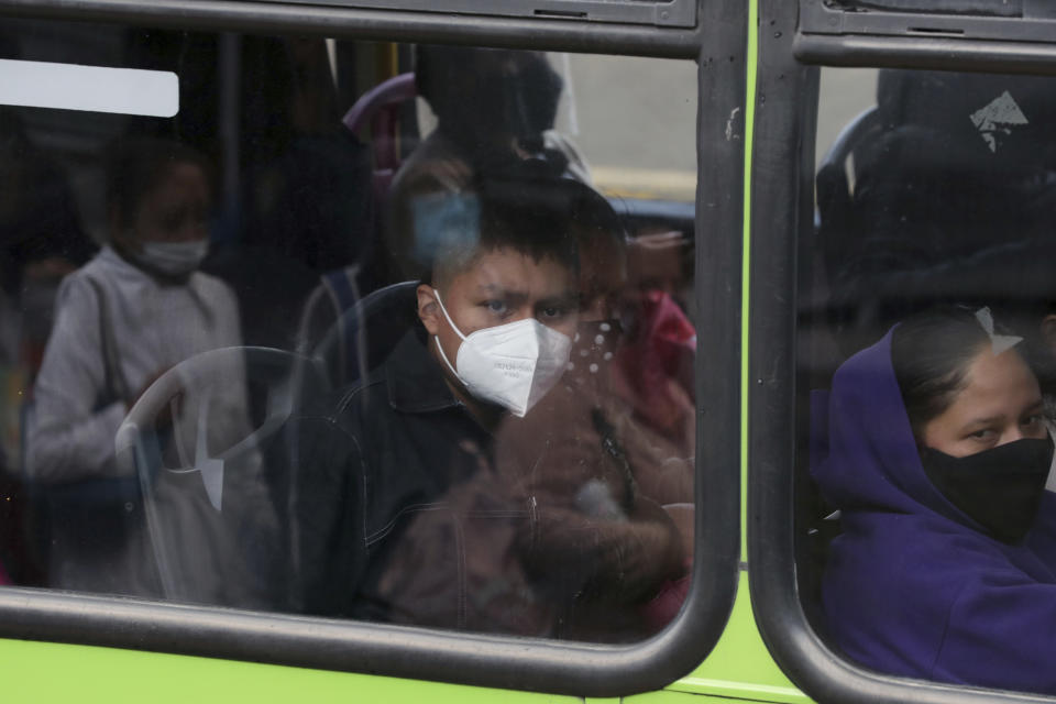 Left without subway service on Line 12 after Monday’s collapse, commuters ride a bus on the south side of Mexico City, Thursday, May 6, 2021. At its farthest point, Line 12 carries commuters from the capital’s still semi-rural south side to jobs across the city. Some 220,000 riders use Line 12 every day. (AP Photo/Marco Ugarte)