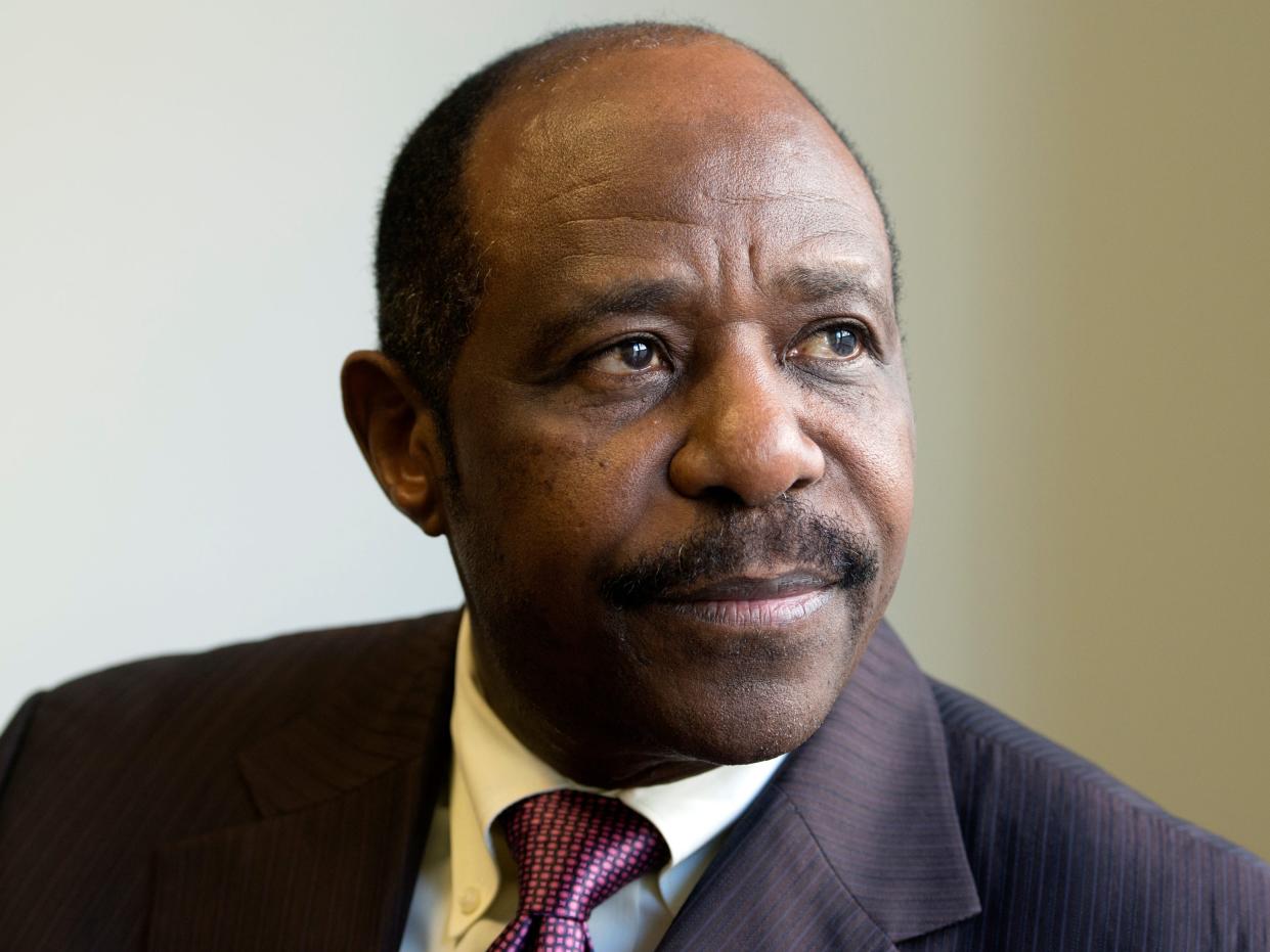 close-up of Paul Rusesabagina looking off into the distance