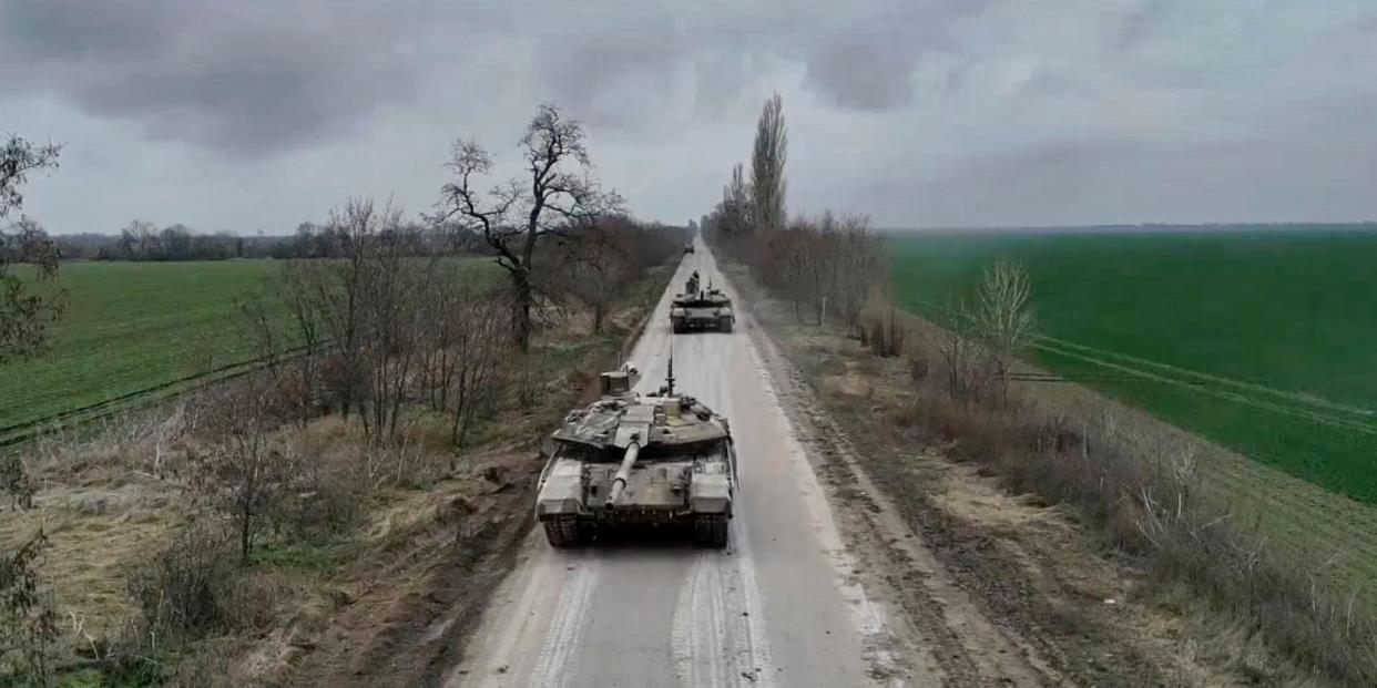 Two Russian T-90M tanks viewed head-on in an undisclosed rural location in Ukraine on a grey day. Image released by by Russian Defense Ministry Press Service on  Jan. 23, 2023