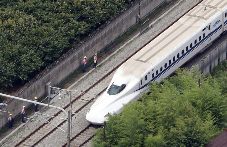 The Nozomi 255 shinkansen bullet train stops near the Odawara station on June 30, 2015 after an apparent suicide attempt on board