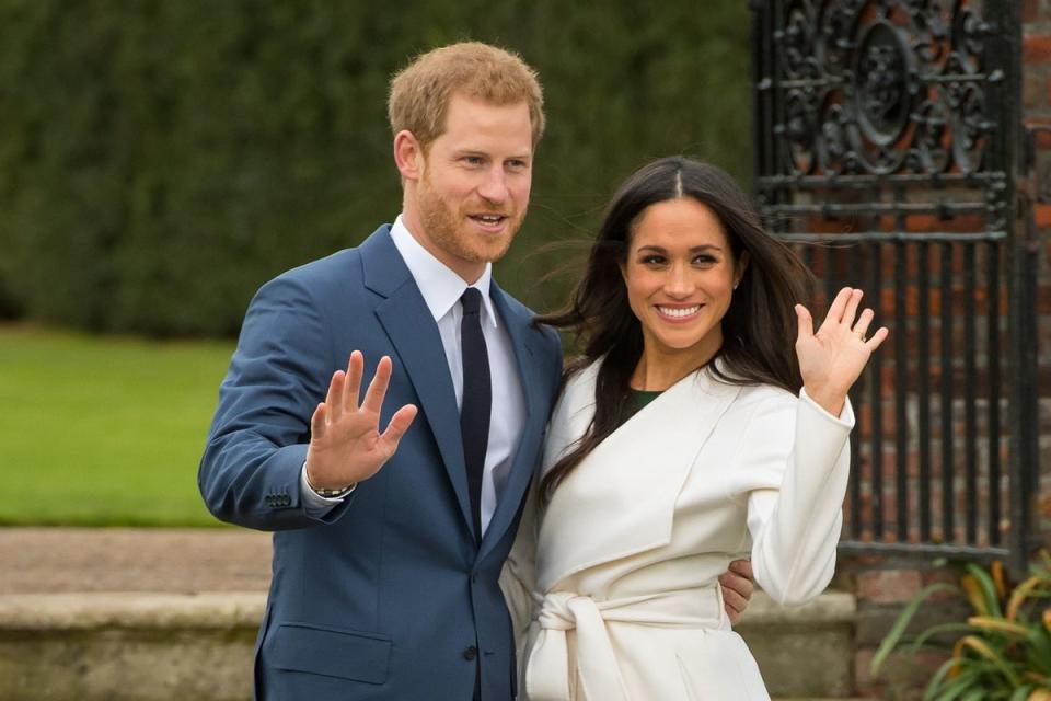 Prince Harry and Meghan Markle in the Sunken Garden at Kensington Palace, London, after the announcement of their engagement (PA)