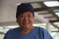 Nepal’s “God of Sight”, Dr. Sanduk Ruit interacts with his patients at an eye camp in Lumbini, 288 kilometers (180 miles) south west of Kathmandu, Nepal, March 31, 2021. The eye doctor renowned for his innovative and inexpensive cataract surgery for the poor is taking his work beyond the Himalayan mountains to other parts of the world so there is no more unnecessary blindness in the world. Ruit, who has won many awards for his work and performed some 130,000 cataract surgery in the past three decades, is aiming to expand his work beyond the borders of his home country and the region to go globally. (AP Photo/Bikram Rai)