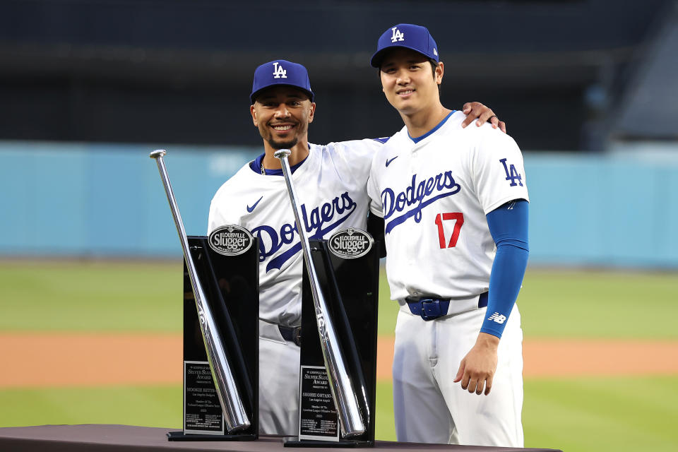 LOS ANGELES, CALIFORNIA - MARCH 29: Mookie Betts #50 and Shohei Ohtani #17 of the Los Angeles Dodgers pose for a photo with trophies for being awarded the Silver Slugger award for the 2023 season prior to a game against the St. Louis Cardinals at Dodger Stadium on March 29, 2024 in Los Angeles, California. (Photo by Sean M. Haffey/Getty Images)