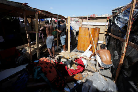 African migrants work on a makeshift house on the outskirts of Casablanca, Morocco September 5, 2018. REUTERS/Youssef Boudlal