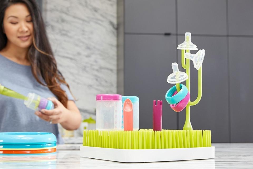 The chore of washing baby bottles may <i>grow</i> on you because you can set them on this cute rack to air-dry.<br /><br /><strong>Promising review:</strong> "This clever invention has been so helpful in organizing and drying all of my son's baby bottles and my pumping supplies!! I can fit (with help from the boon twig and flower stem as well) several bottles and two sets of pumping supplies on this rack at the same time. <strong>I'm glad I got this version, as it fits everything perfectly and takes up less space on our already small counter!</strong> I would highly recommend this, as it makes washing all those bottles and pump parts a lot easier!!" &mdash; <a href="https://amzn.to/2RCTgN8" target="_blank" rel="nofollow noopener noreferrer" data-skimlinks-tracking="5902331" data-vars-affiliate="Amazon" data-vars-href="https://www.amazon.com/gp/profile/amzn1.account.AGZYJEUIQVRPDXXNWAANJYLO4TJQ?tag=bfmal-20&amp;ascsubtag=5902331%2C29%2C37%2Cmobile_web%2C0%2C0%2C16540743" data-vars-keywords="cleaning,fast fashion" data-vars-link-id="16540743" data-vars-price="" data-vars-product-id="16069689" data-vars-retailers="Amazon">skellimae</a>﻿<br /><br /><strong>Get it from Amazon for <a href="https://www.amazon.com/Boon-Grass-Countertop-Drying-Green/dp/B0032G9E0G" target="_blank" rel="nofollow noopener noreferrer" data-skimlinks-tracking="5902331" data-vars-affiliate="Amazon" data-vars-asin="B0032G9E0G" data-vars-href="https://www.amazon.com/dp/B0032G9E0G?tag=bfmal-20&amp;ascsubtag=5902331%2C29%2C37%2Cmobile_web%2C0%2C0%2C16540730" data-vars-keywords="cleaning,fast fashion" data-vars-link-id="16540730" data-vars-price="" data-vars-product-id="17411276" data-vars-product-img="https://images-na.ssl-images-amazon.com/images/I/71fDR3AREqL.jpg" data-vars-product-title="Boon Grass Countertop Baby Bottle Drying Rack, Green" data-vars-retailers="Amazon">$12.99</a> (available in five styles).</strong>