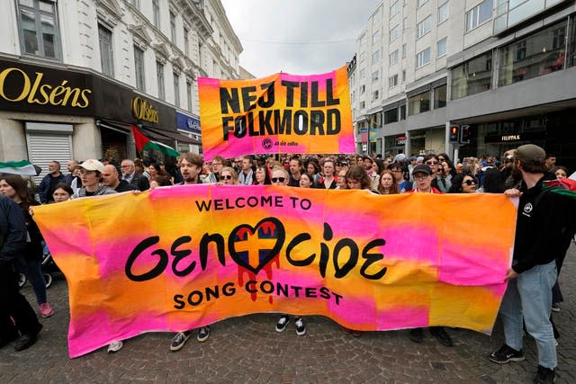 Protesters hold up a banner with the words in Swedish No To Genocide 