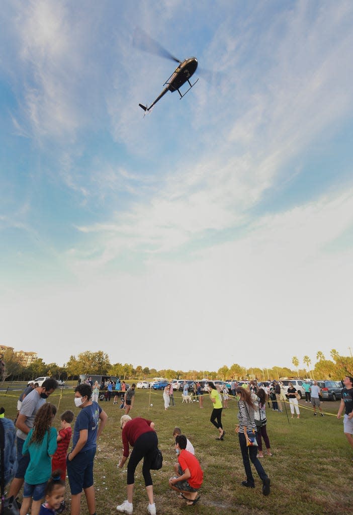 A helicopter drops gelt, little chocolates wrapped in silver to resemble coins, at the annual Taste of Chanukah event returning to Phillippi Estate Park on Sunday.